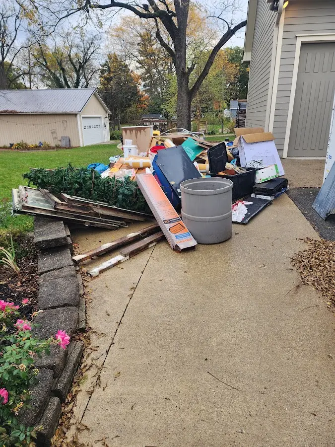Dumpster being loaded with debris for 30 Yard Dumpster Rental in Westmont